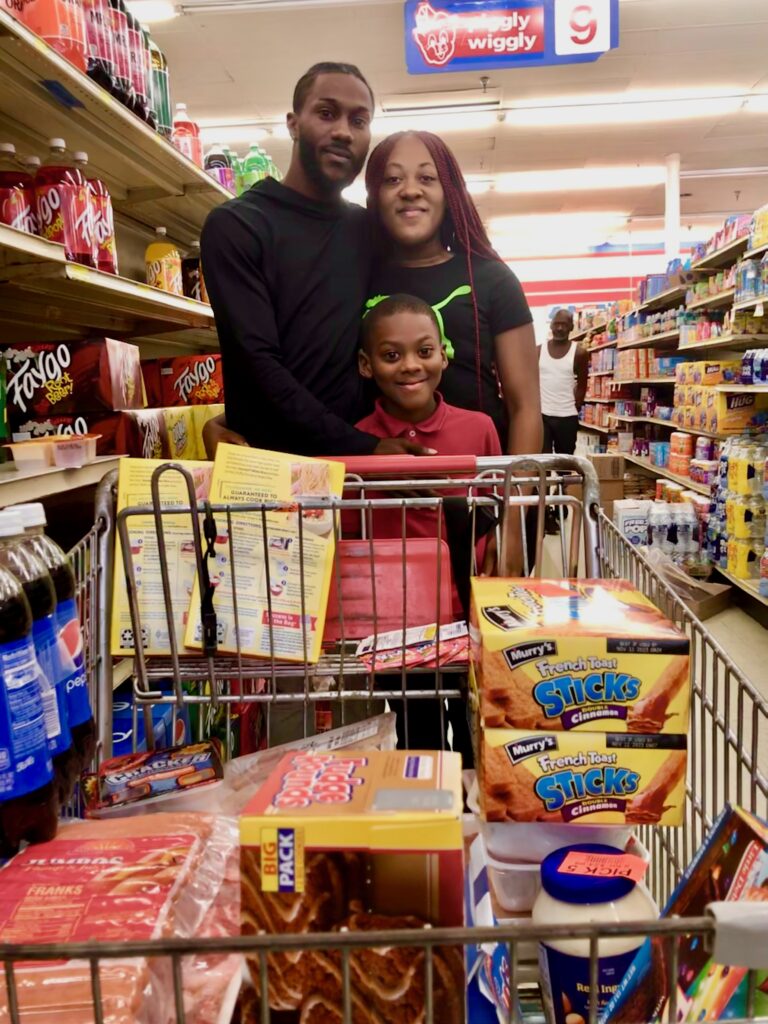 Ronekia Earley, 29, who was shopping at Piggly Wiggly in southeast Atlanta with her fiancé, Tereze Fortson, 30,  and their son Aiden, 9, this week. (Jill Jordan Sieder for State Affairs)