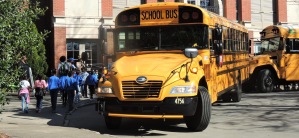 Bus with kids walking