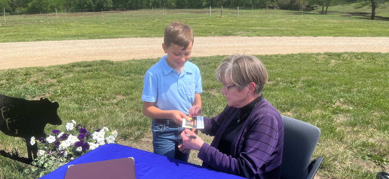 Gov. Laura Kelly on Wednesday hands a signed card to Kennan Breiner, who turned 12 on Thursday. "A very good early birthday present," he said about meeting Kelly.