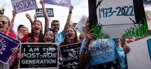 Anti-abortion activists celebrate after the Supreme Court issued its opinion on Dobbs v. JWHO