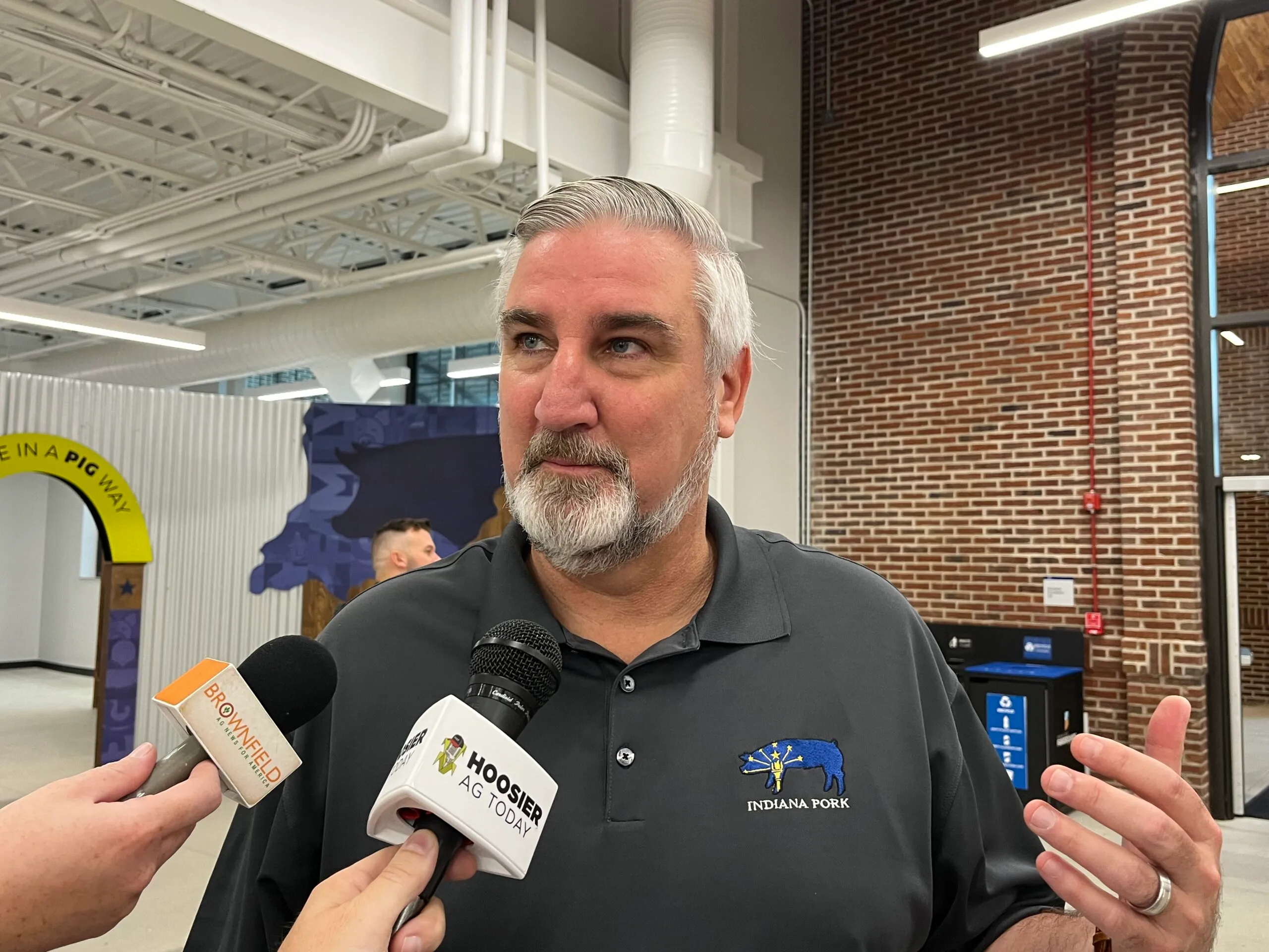 Indiana Gov. Eric Holcomb speaks with reporters after the Indiana State Fair opening ceremony on Aug. 28, 2023. (Credit: Tom Davies)
