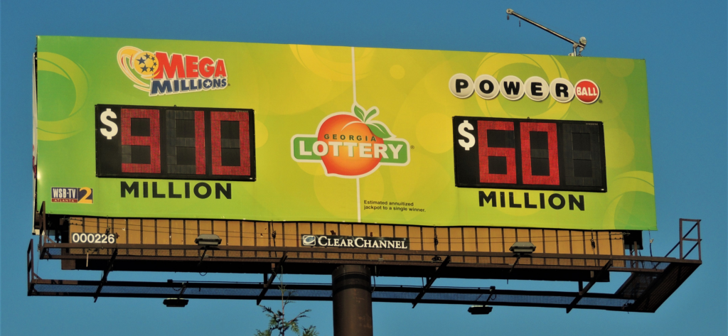 Powerball and Mega Millions lottery jackpot numbers loom over I-20 East on a billboard near downtown Atlanta on July 27, 2023. (Credit: Jill Jordan Sieder)