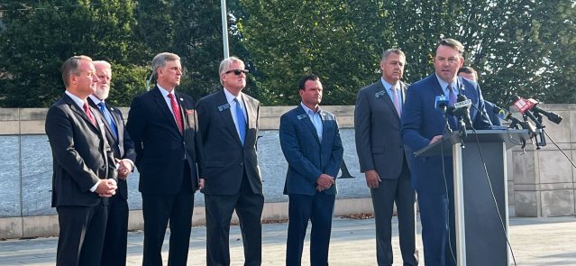 Sens. John Albers (left), Randy Robertson, Marty Harbin, Mike Hodges, Clint Brown, Steve Gooch and Jason Anavitarte listen as Lt. Gov. Burt Jones addresses the crowd at the press conference in response to the incidents and challenges reported at the Fulton County Jail. (Credit: Tammy Joyner)