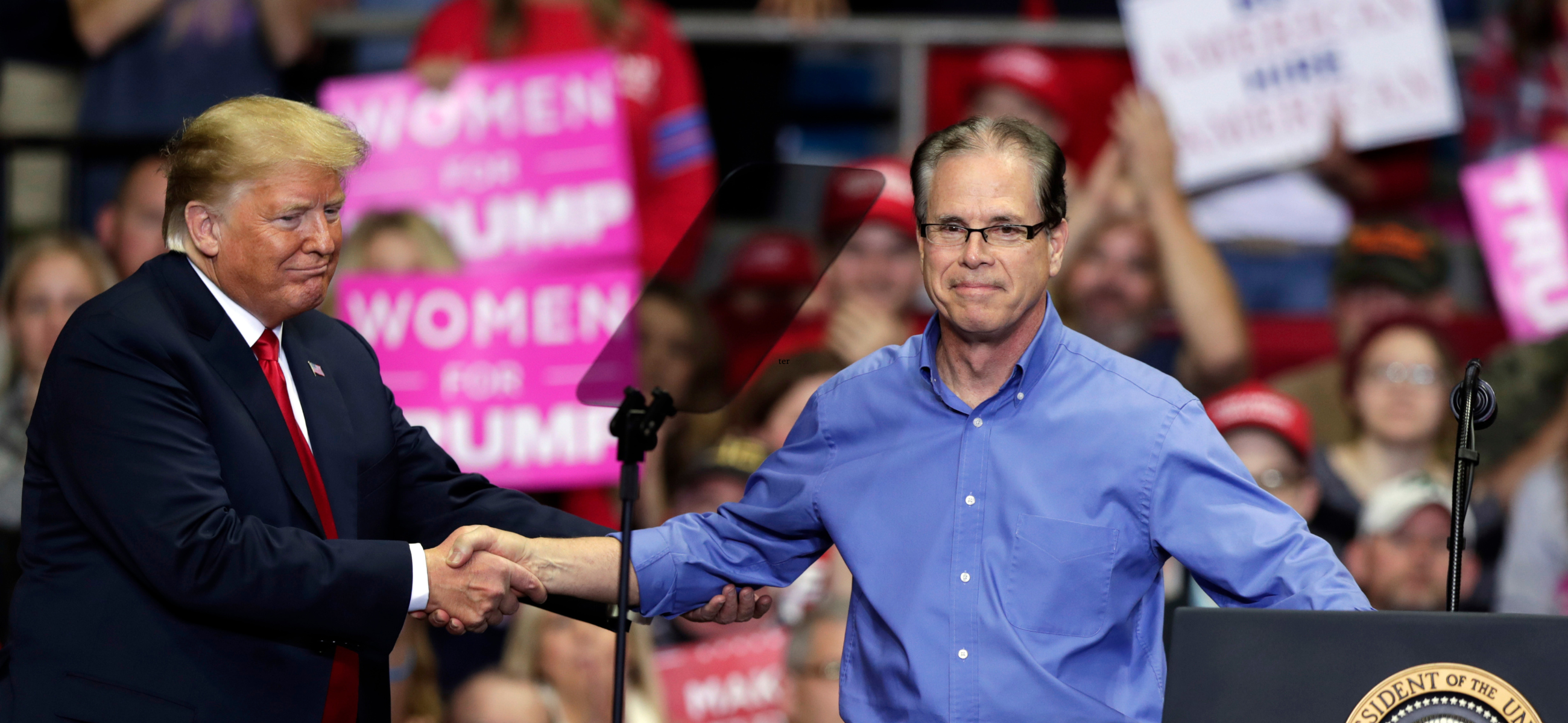 President Donald Trump greets Senate candidate Mike Braun at a campaign rally at the Allen County War Memorial Coliseum in Fort Wayne in 2018. (Credit: Michael Conroy)