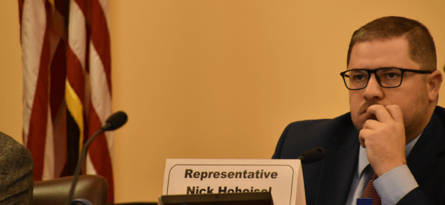 Rep. Nick Hoheisel, chair of the Joint Committee on Pensions, Investments and Benefits, listens to testimony Friday.