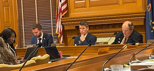 Reps. Brandon Woodard, Steven Howe and Clarke Sanders listen during debate over an anti-DEI bill on March 7, 2024.
