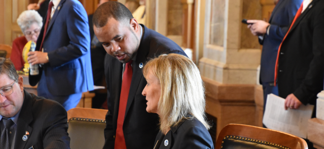 Reps. Patrick Penn and Susan Humphries talk March 25, 2024, on the House floor.
