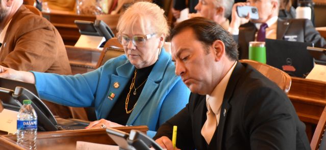 Reps. Susan Concannon and Troy Waymaster listen to debate March 13, 2024, on the House floor.