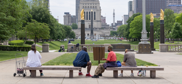People stop to rest at the American Legion Mall in downtown Indianapolis. (Credit: Mark Curry)