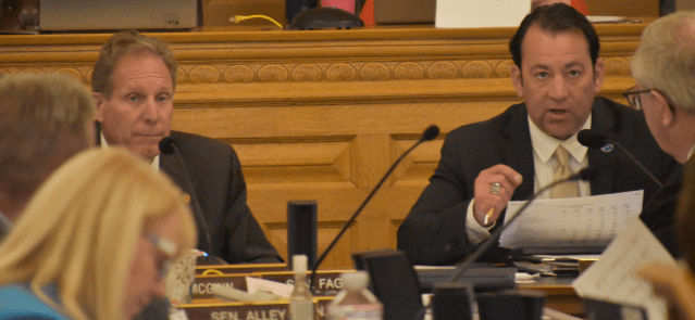 Rep. Troy Waymaster, right, speaks as Sen. Rick Billinger listens on April 25, 2024, at a joint meeting of the House Appropriations and Senate Ways and Means committees.