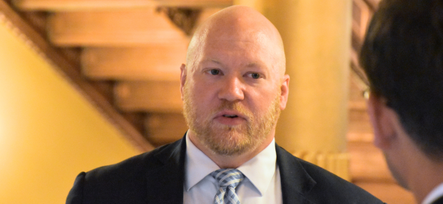 Will Lawrence, Gov. Laura Kelly's chief of staff, speaks in the hallway June 18, 2024, during the special session.