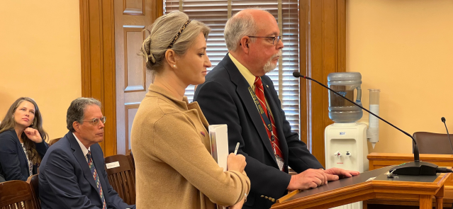 Aetna Better Health President Jane Brown, left, and Brian Vazquez, general counsel for Kansas Department of Health and Environment, take turns answering questions Aug. 27, 2024, at a KanCare Oversight Committee meeting.