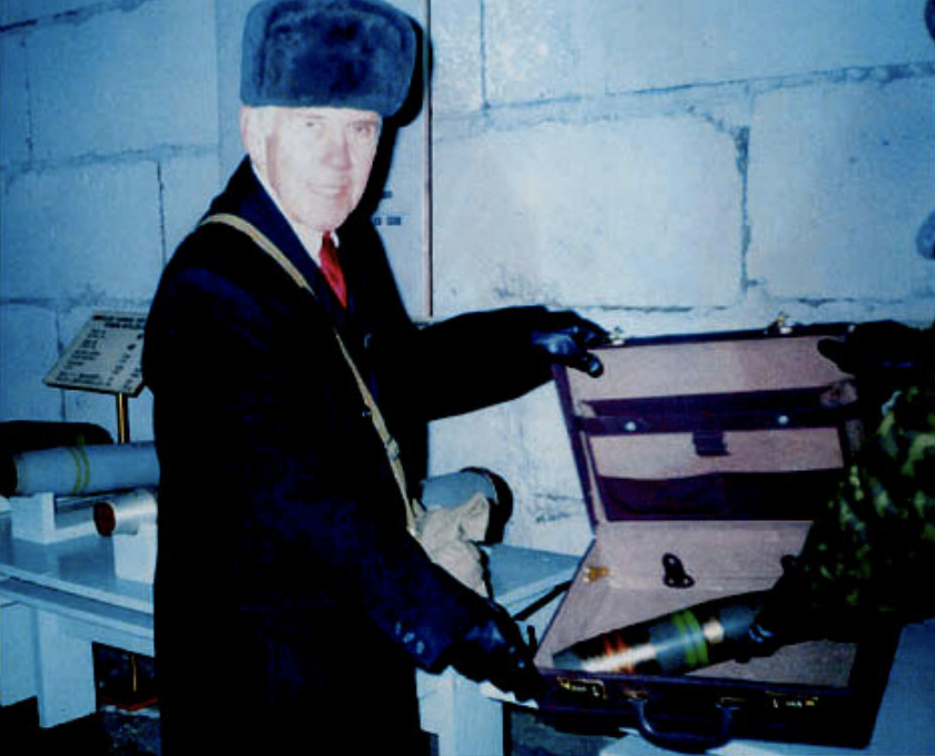 Sen. Richard Lugar holds a briefcase containing an 85 mm chemical shell during a visit to the chemical weapons depository at Shchuchye, Russia, in December 2000. (Credit: Nunn-Lugar Photo)