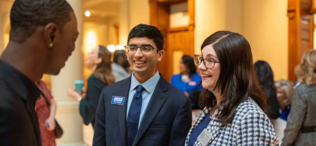 State senate candidate Ashwin Ramaswami, center, talks to former state House candidate Joshua Anthony and state House staffer Melanie Jacobson. (Credit: Ashwin for Georgia campaign)